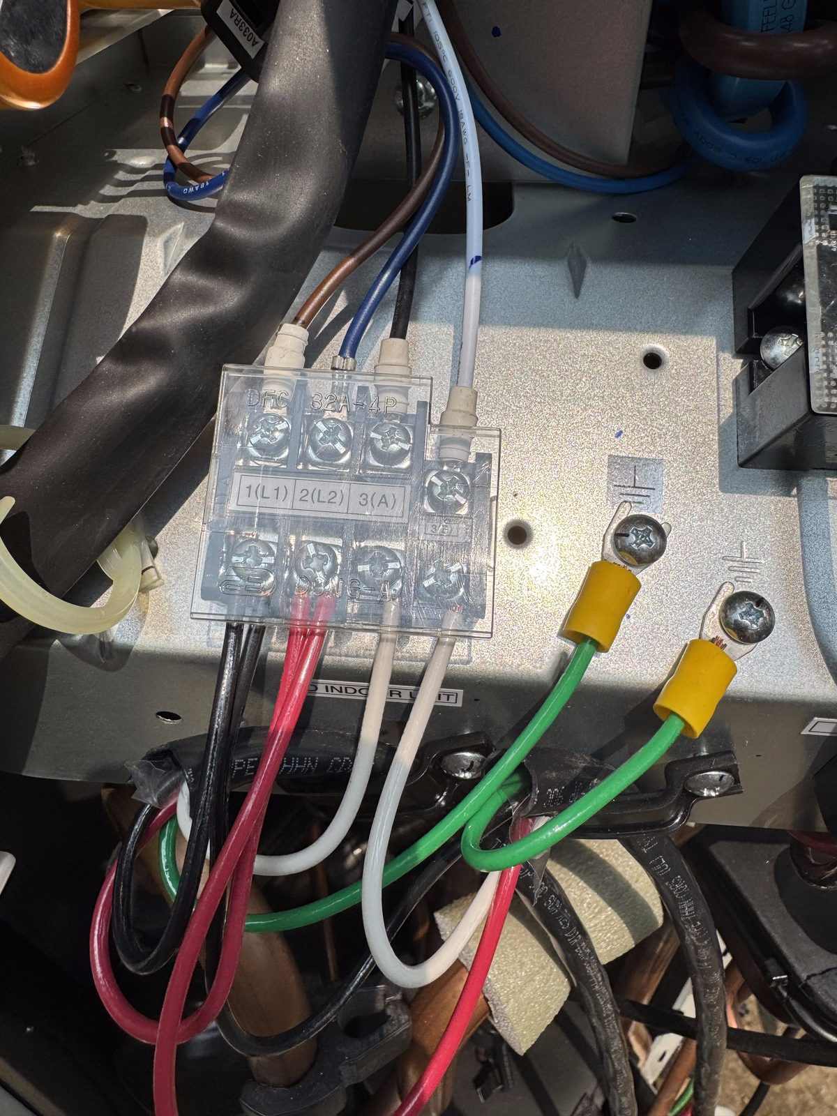Professional wiring terminal block connections with color-coded wires